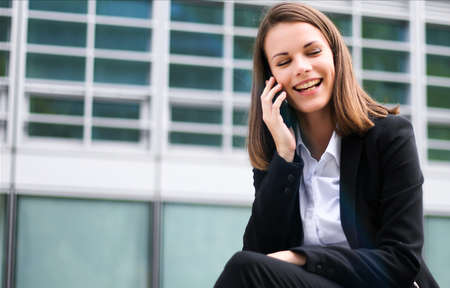 Portrait of a young woman talking on the phoneの写真素材