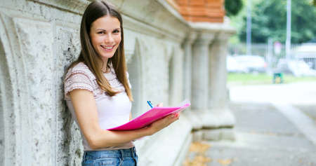 Smiling student outdoorの写真素材