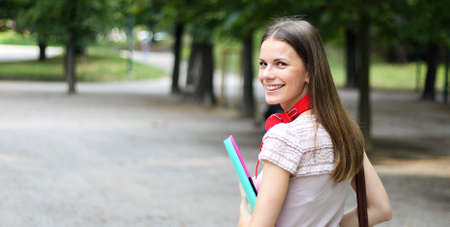 Smiling student outdoorの写真素材