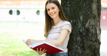 Smiling student outdoorの写真素材
