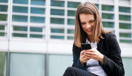 Portrait of a young woman talking on the phoneの写真素材