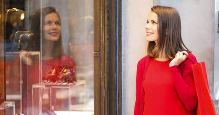 Young woman shopping with a Christmas outfitの写真素材