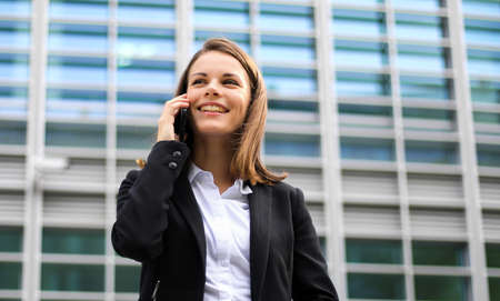 Portrait of a young woman talking on the phoneの写真素材