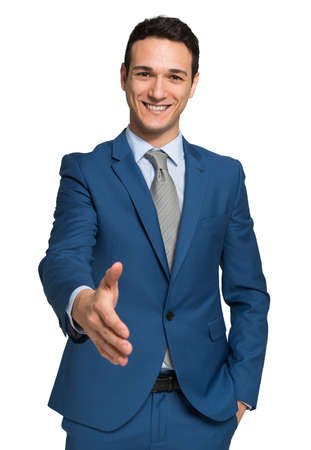 Young businessman giving an handshake, isolated on whiteの写真素材