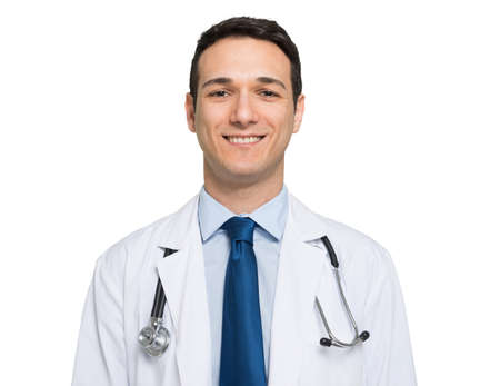 Friendly young doctor portrait. Isolated on whiteの写真素材