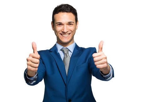 Businessman giving two thumbs up isolated on white backgroundの写真素材