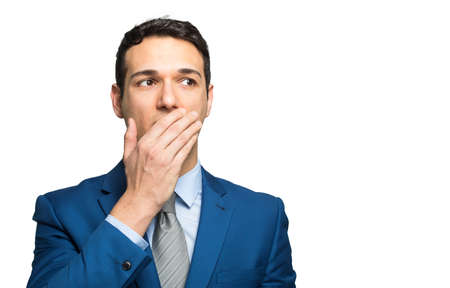 Young businessman in an embarrassing situationの写真素材