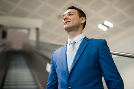 Businessman on Escalatorの写真素材