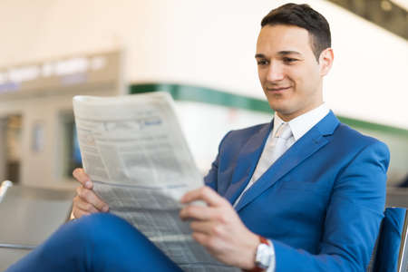 Man reading newspaperの写真素材