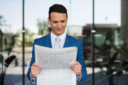 Manager reading the newspaperの写真素材