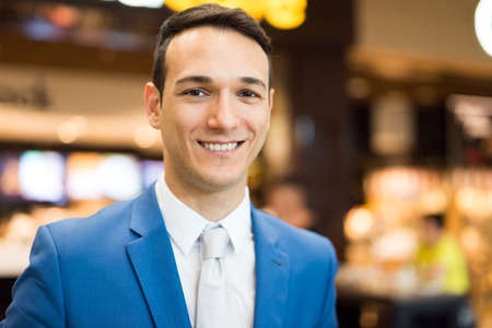 Businessman in grocery storeの写真素材