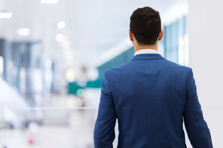 Back view of a manager walkingの写真素材