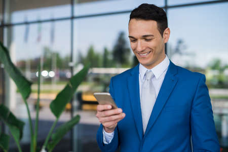 Businessman using his mobile phoneの写真素材