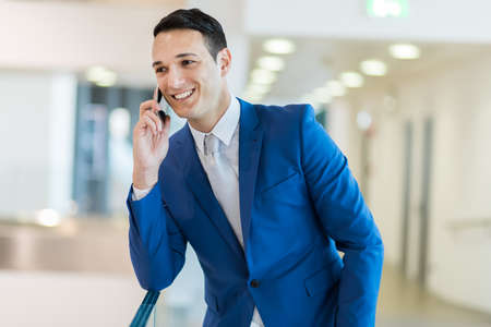 Young manager on the phoneの写真素材