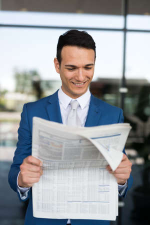 Man reading newspaperの写真素材