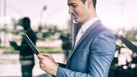 Detail of a businessman using his tabletの写真素材