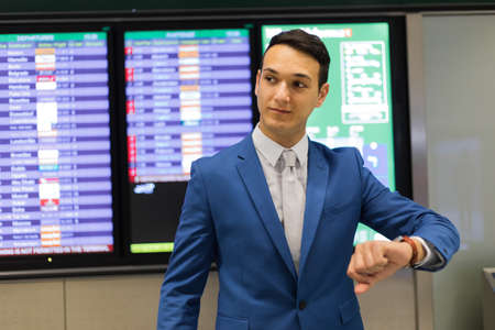 Man checking time in a train stationの写真素材