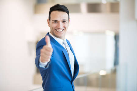Businessman doing thumbs up signの写真素材