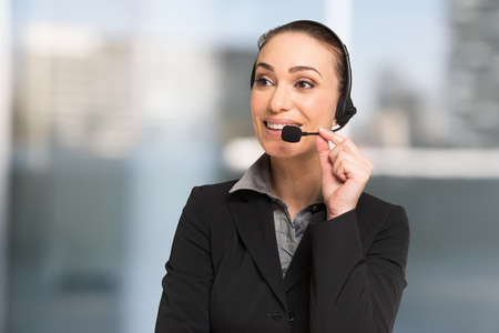 Customer service concept, businesswoman talking to a customer using an headsetの写真素材