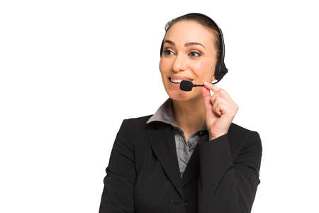 Businesswoman talking through an headset on a white backgroundの写真素材