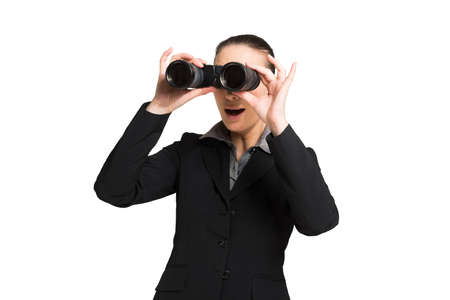 Businesswoman using binoculars. Isolated on whiteの写真素材