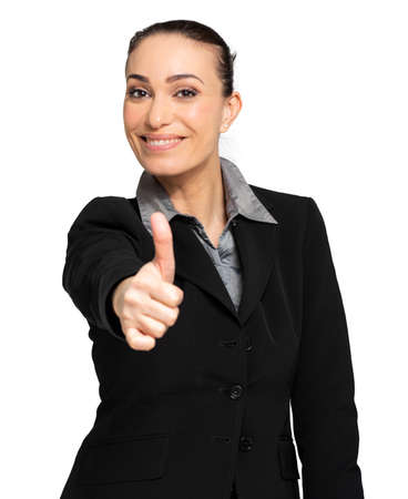 Beautiful businesswoman showing thumbs up isolated over white backgroundの写真素材
