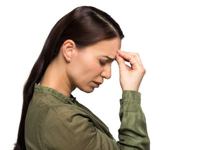 Young woman has headache, isolated on white backgroundの写真素材