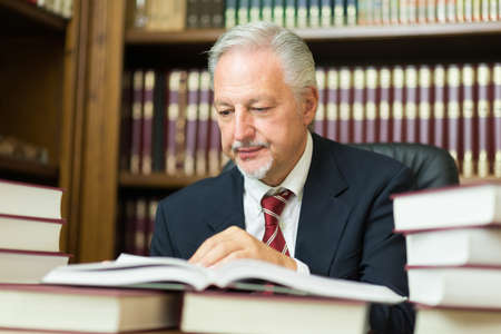 Businessman reading a bookの写真素材