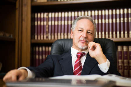 Senior businessman thinking about somethingの写真素材