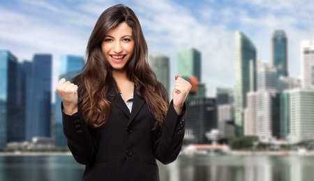 Young businessman in a victory poseの写真素材