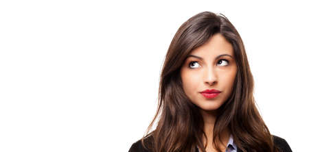Portrait of a beautiful young woman thinkingの写真素材