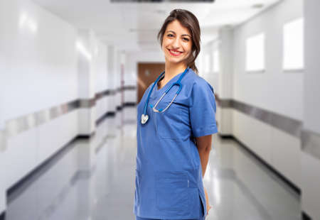 Female doctor portrait in a hospital hallの写真素材