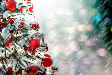 Christmas tree against a glittery luminous backgroundの写真素材