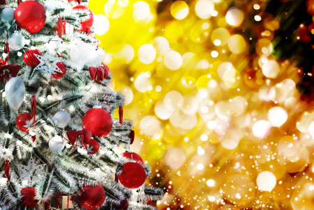 Christmas tree against a glittery luminous backgroundの写真素材