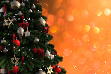 Christmas tree against a glittery luminous backgroundの写真素材