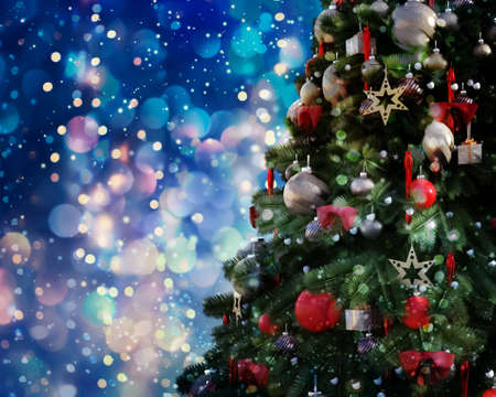 Christmas tree against a glittery luminous backgroundの写真素材