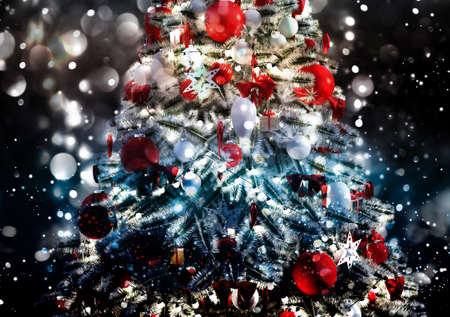 Christmas tree against a glittery luminous backgroundの写真素材
