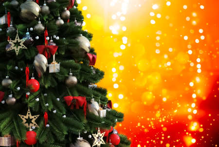 Christmas tree against a glittery luminous backgroundの写真素材