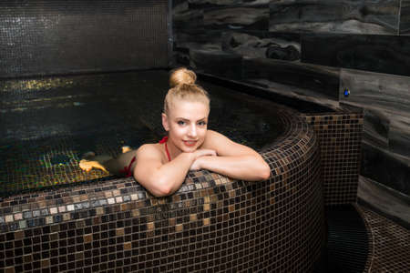 Beautiful woman relaxing in a spaの写真素材