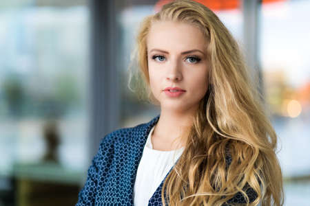Confident young female manager outdoor in a modern urban settingの写真素材