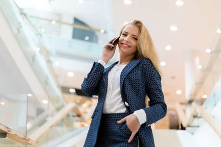 Portrait of a young woman talking on the phoneの写真素材