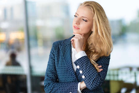 Confident young female manager outdoor in a modern urban settingの写真素材
