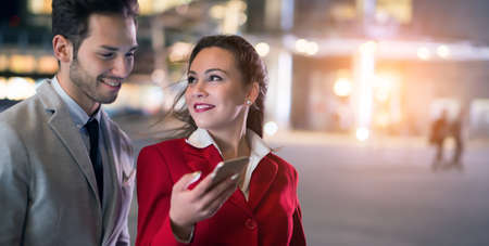 Business people using a mobile phone together