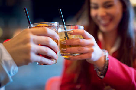 People toasting a cocktailの写真素材