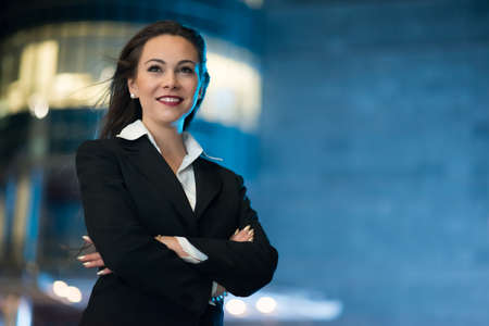 Smiling woman portrait at nightの写真素材