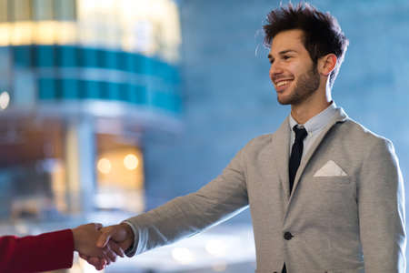 Handshake between business people outdoorの写真素材