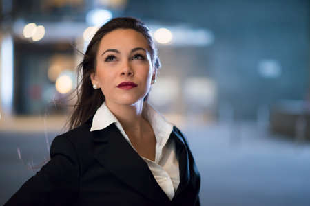 Business woman portrait at nightの写真素材