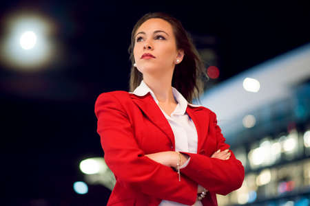 Business woman portrait at nightの写真素材