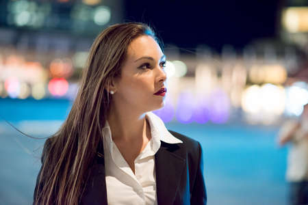 Business woman portrait at nightの写真素材
