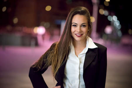 Business woman portrait at nightの写真素材
